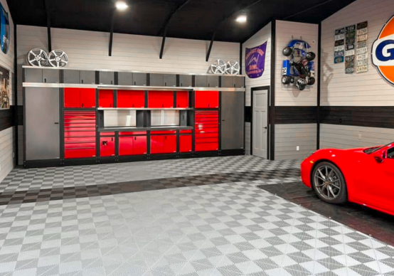 renovated garage with Swisstrax flooring and custom cabinets