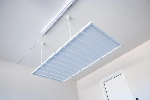 Ceiling-mounted privacy screen for overhead storage